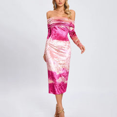 Woman wearing a pink and white tie-dye dress on a light gray background