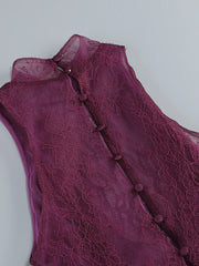 Close-up of a purple lace garment with buttons on a light gray background