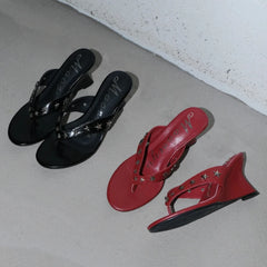 Red and black wedge sandals with star embellishments