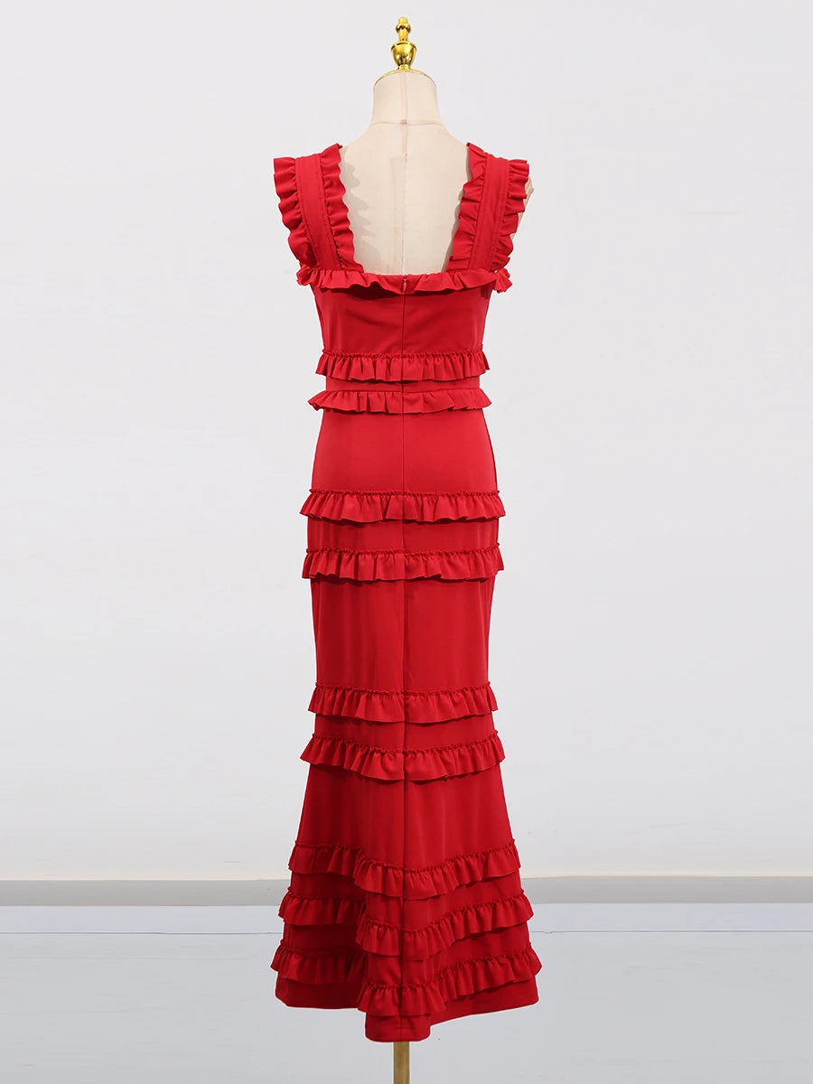 Red ruffled dress on a mannequin against a white background