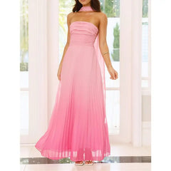 Pink halter neck gown being worn in a bright room with white curtains.