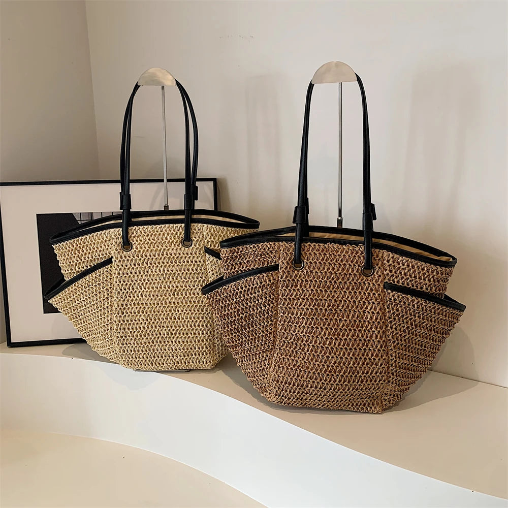 Two woven bags with black handles on a light surface.
