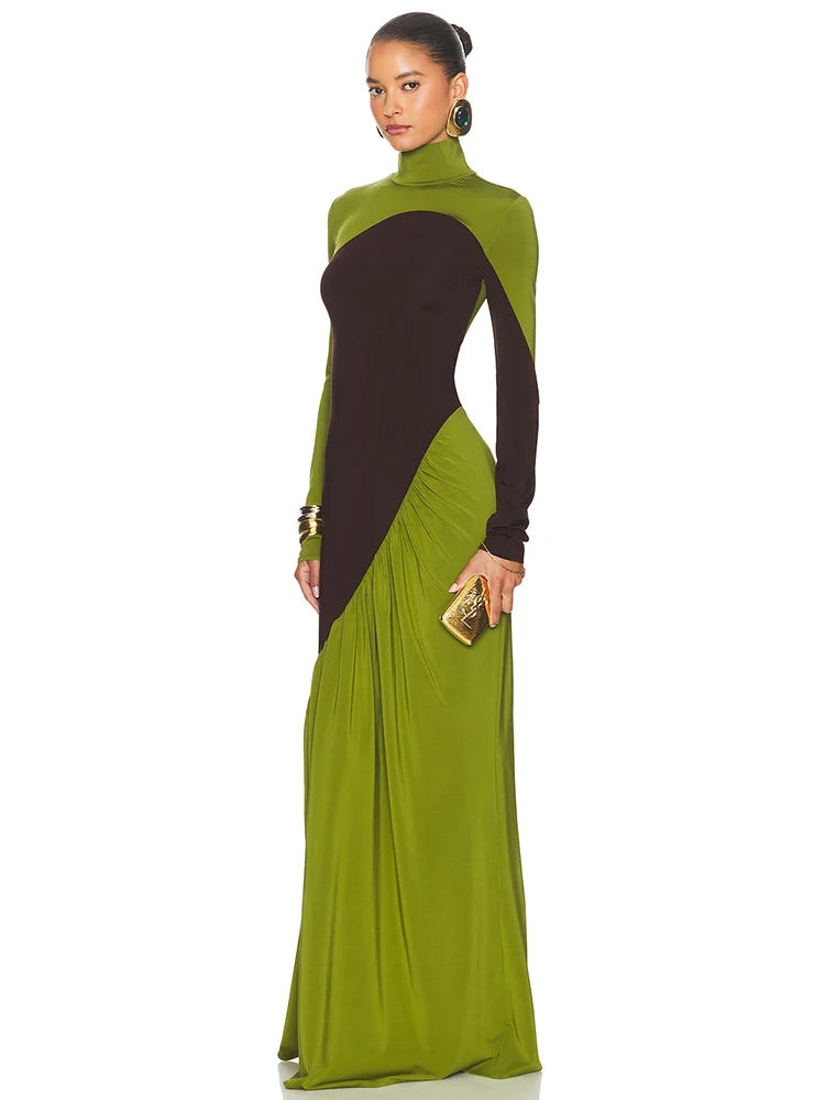 Woman wearing a green and black dress