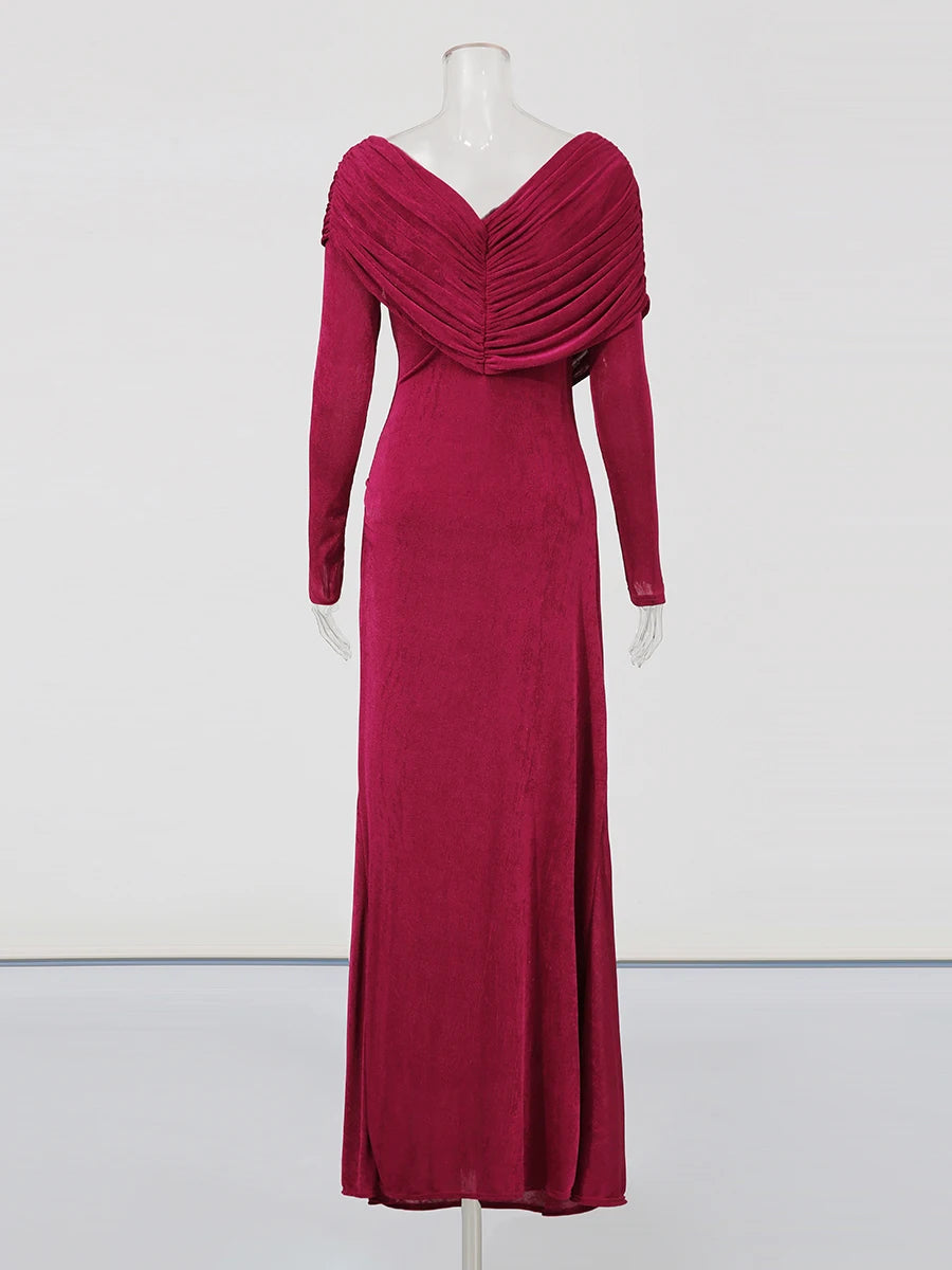 Red evening gown on a mannequin against a white background