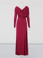 Red evening gown on a mannequin against a white background