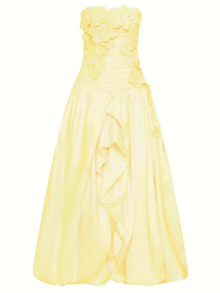 Yellow strapless dress on a white background