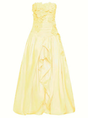 Yellow strapless dress on a white background