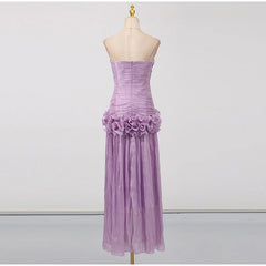 Purple strapless gown with floral details on a mannequin against a white background