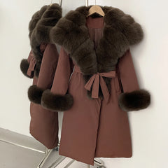 Brown coat with fur trim on a hanger