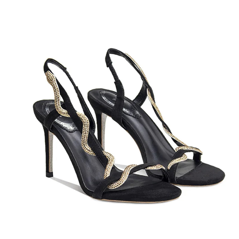 Black stiletto sandals with a rhinestone encrusted one-word strap and back strap.