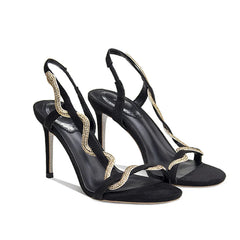 Black stiletto sandals with a rhinestone encrusted one-word strap and back strap.