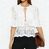 Lace tie-front cape blouse with ruffled hem and short sleeves in white