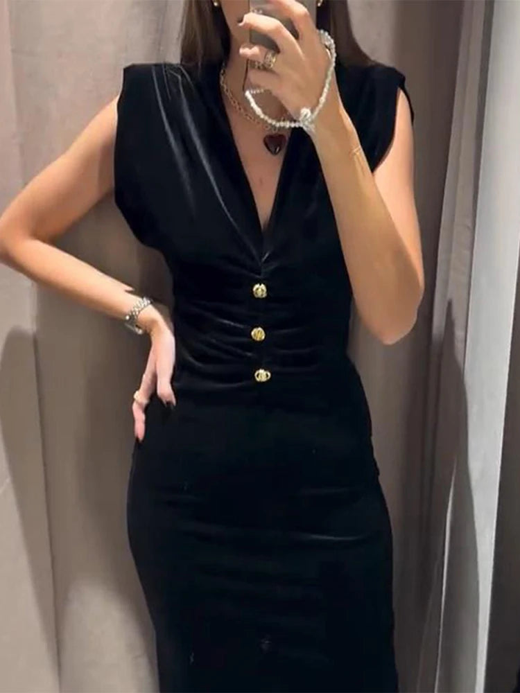 Velvet v-neck midi dress with padded shoulders and ruched waist detail