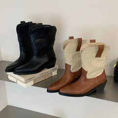 Mixed color and black pointed toe ankle boots displayed