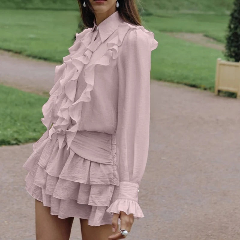 Side view of ruffled tiered mini dress with cinched waist