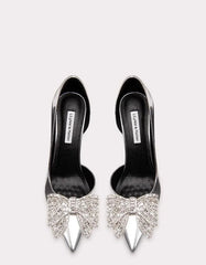 Black high-heeled shoes with silver bow designs on a white background