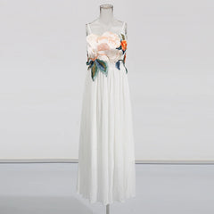 White dress with floral embroidery on a mannequin against a white background