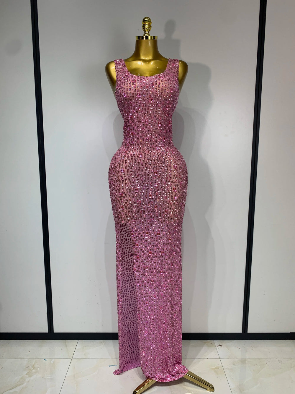 Pink diamond-embellished maxi dress on a mannequin