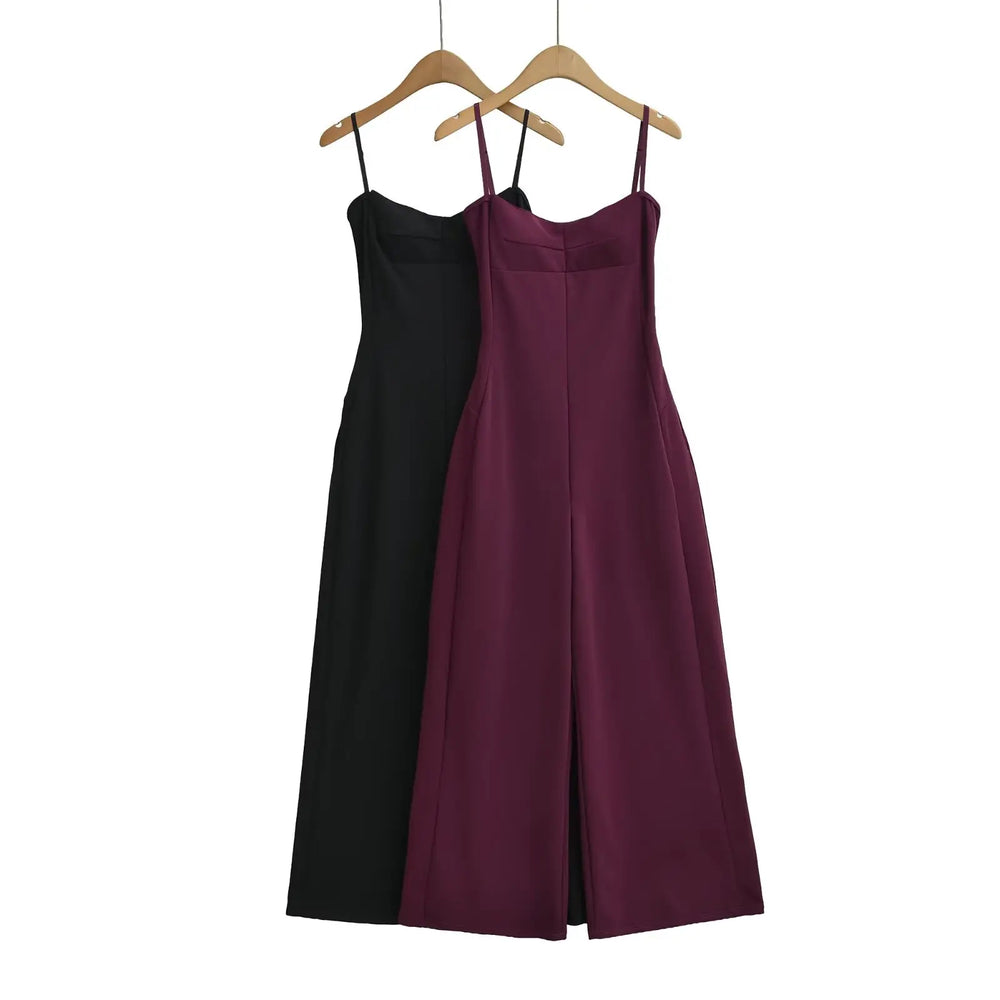 Black wide-leg jumpsuit with spaghetti straps and sweetheart neckline.