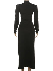 Black dress on a mannequin against a white background