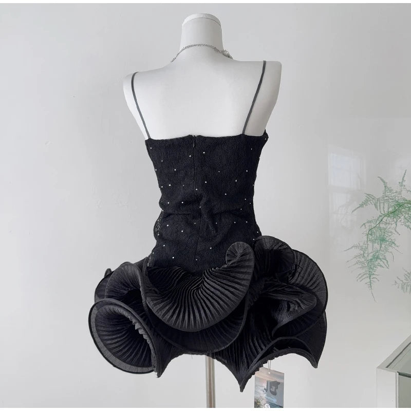 Rhinestone embellished wavy ruffled mini dress side back view.