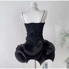 Rhinestone embellished wavy ruffled mini dress side back view.