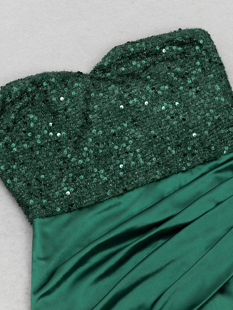 Green sequin top and satin skirt on a light gray background