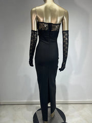 Mannequin wearing a black dress with lace sleeves against a plain background