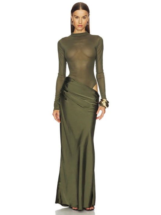 Woman wearing a green evening gown with a white background