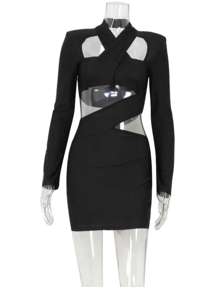 Black dress with sheer cutouts on a mannequin against a white background