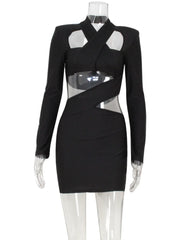 Black dress with sheer cutouts on a mannequin against a white background