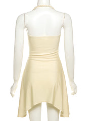 Mannequin wearing a beige dress with a white background
