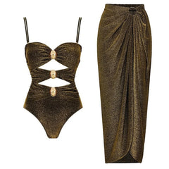 Sparkle print one-piece swimsuit with gold accents and a matching wrap skirt.