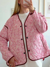 Quilted jacket with pink paisley print and dark contrast trim