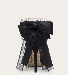 Black lace bow with decorative elements on a white background