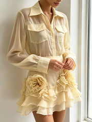 Model wearing the sheer lapel top and ruffle skirt set indoors