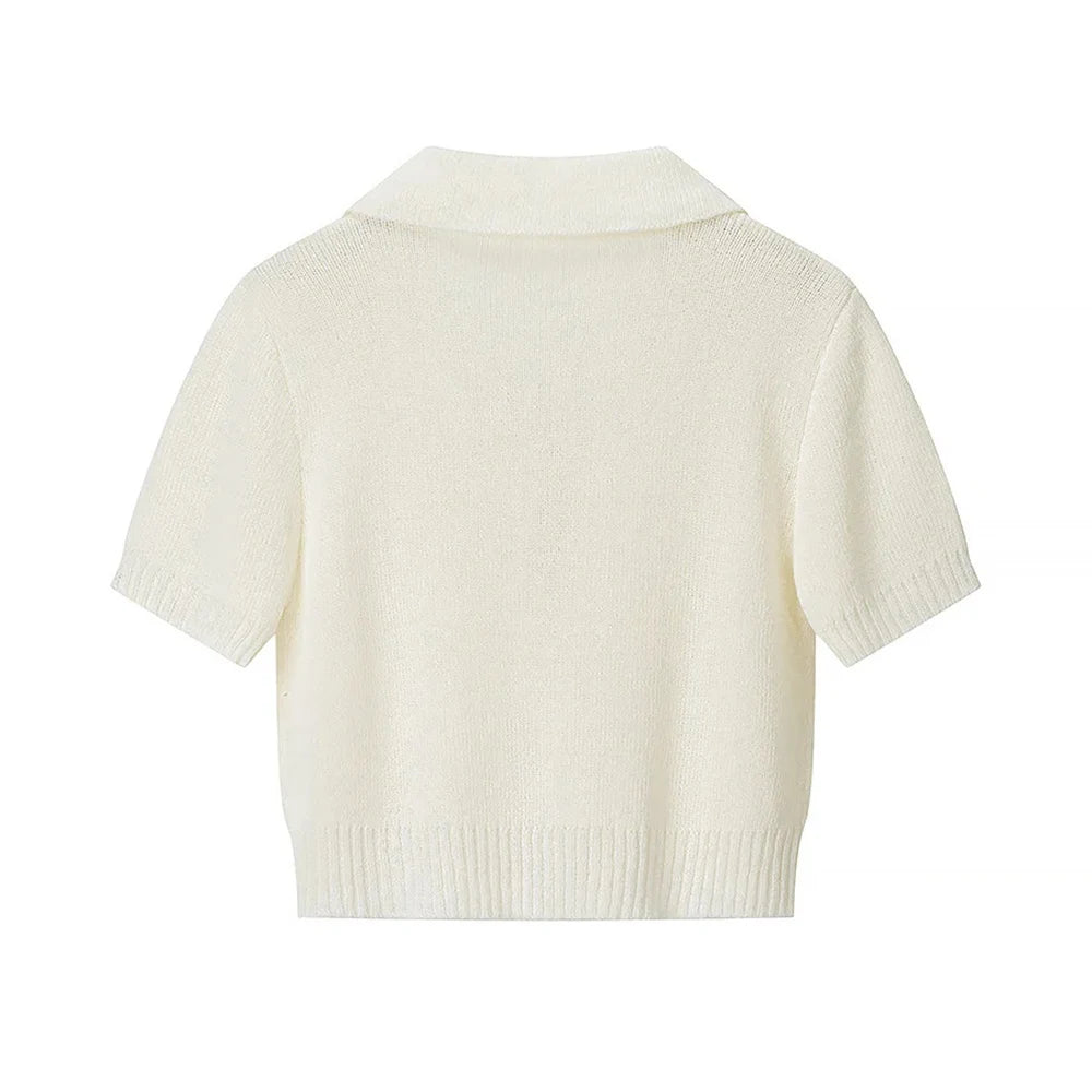 White knitted cardigan on a white background