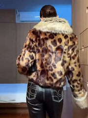 Person wearing a leopard print jacket with white fur trim in an indoor setting
