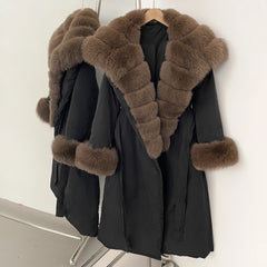 Black coat with brown fur trim on a hanger
