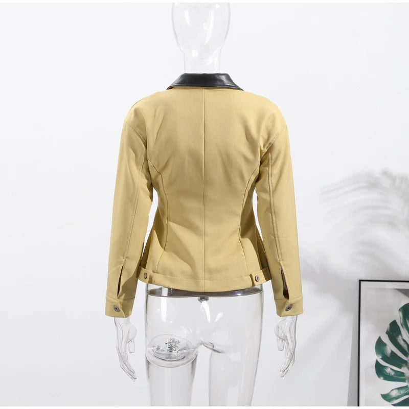 Yellow jacket on a mannequin against a white background