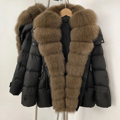 Black puffer jacket with brown fur hood on a hanger