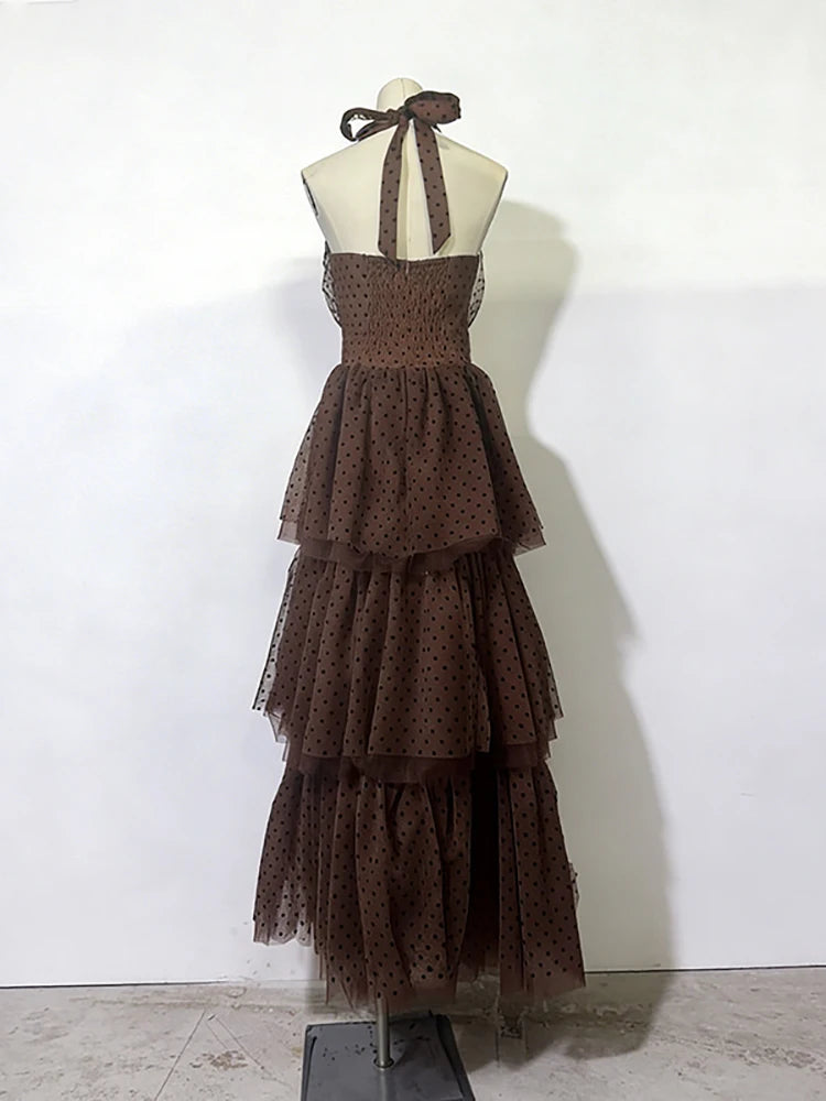 Brown tiered dress on a mannequin against a white background