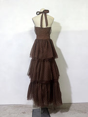 Brown tiered dress on a mannequin against a white background