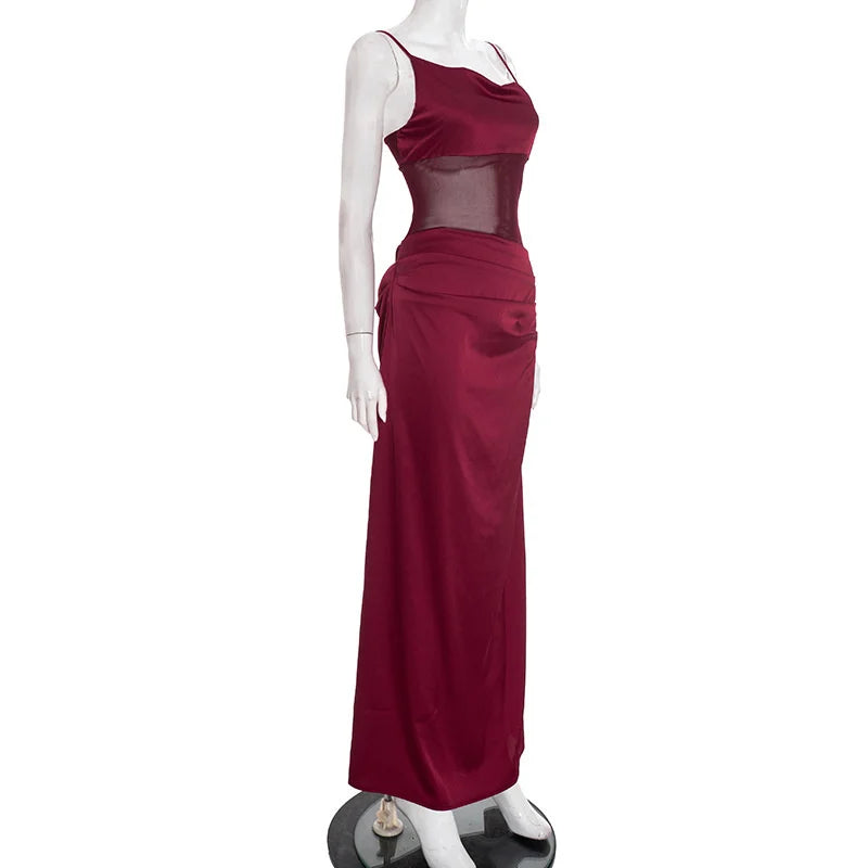 Mannequin wearing a burgundy evening gown on a white background