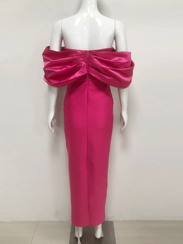 Pink off-shoulder dress on a mannequin against a white background