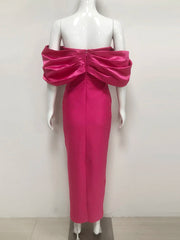 Pink off-shoulder dress on a mannequin against a white background