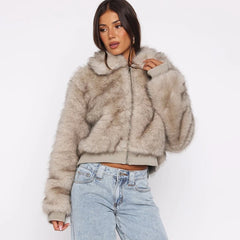 Woman wearing a fluffy beige jacket and light blue jeans