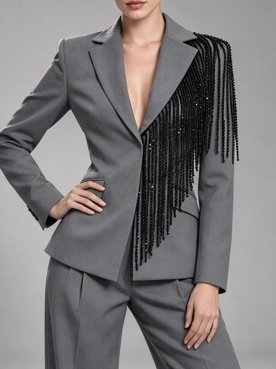 Grey sequin embellished lapel blazer with hand on hip