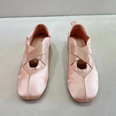 Top view of pink satin ballet flats with crisscross straps