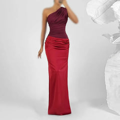 One-shoulder burgundy and red evening gown on a white background